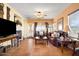 Comfortable living room with fireplace and large windows at 10725 E Second Water Trl, Gold Canyon, AZ 85118