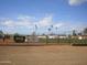 Outdoor baseball field with surrounding fence and signage at 10731 W Mission Ln, Sun City, AZ 85351