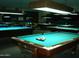 Room with multiple billiard tables available for recreation at 10731 W Mission Ln, Sun City, AZ 85351