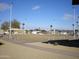Community bocce ball court with benches and shade structures at 10731 W Mission Ln, Sun City, AZ 85351