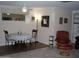 Bright dining area with table, chairs, and view into living room at 10731 W Mission Ln, Sun City, AZ 85351