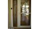 Elegant front door with decorative glass and matching sidelight at 10731 W Mission Ln, Sun City, AZ 85351