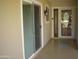 Inviting front porch with decorative glass door, window, and sliding glass door for easy indoor/outdoor living at 10731 W Mission Ln, Sun City, AZ 85351