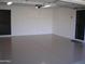 Bright garage with painted floor and ample storage space at 10731 W Mission Ln, Sun City, AZ 85351