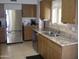 Kitchen with stainless steel appliances and double sink at 10731 W Mission Ln, Sun City, AZ 85351