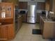 Kitchen view showcasing cabinets, countertops, a sink, and tile flooring at 10731 W Mission Ln, Sun City, AZ 85351