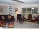 Spacious living room featuring comfortable seating and large windows at 10731 W Mission Ln, Sun City, AZ 85351