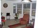 Sunroom with ample natural light and relaxing seating at 10731 W Mission Ln, Sun City, AZ 85351