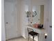 Vanity area with a mirror and storage at 10731 W Mission Ln, Sun City, AZ 85351