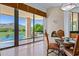 Elegant dining area with fireplace and panoramic views at 11264 E Apache Vistas Dr, Scottsdale, AZ 85262