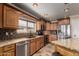 Charming kitchen features stainless appliances, granite counters, and lots of cabinet space at 11346 E Renata Ave, Mesa, AZ 85212