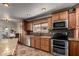 Spacious kitchen with granite counters, stainless appliances, cabinets and eat in bar at 11346 E Renata Ave, Mesa, AZ 85212