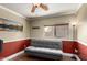 Living room features a futon and large windows at 11346 E Renata Ave, Mesa, AZ 85212