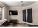 The living room includes a TV, a couch, and a window at 11346 E Renata Ave, Mesa, AZ 85212