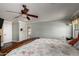 This main bedroom has a ceiling fan and an ensuite at 11346 E Renata Ave, Mesa, AZ 85212