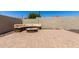 Patio with brick pavers, a built-in bench, and a fire pit, perfect for outdoor entertaining at 11346 E Renata Ave, Mesa, AZ 85212