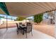 Covered patio with seating area in backyard at 1417 S Grand Dr, Apache Junction, AZ 85120