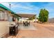 Covered patio with table, chairs, and grill at 1417 S Grand Dr, Apache Junction, AZ 85120