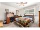 Bedroom with queen bed, desk and built-in shelving at 1417 S Grand Dr, Apache Junction, AZ 85120