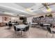 Community room with tables, chairs, and a library at 1417 S Grand Dr, Apache Junction, AZ 85120