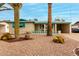 Mid-century home features a unique architectural style and mature landscaping at 1417 S Grand Dr, Apache Junction, AZ 85120