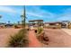 Landscaped front yard with brick pathway and pergola at 1417 S Grand Dr, Apache Junction, AZ 85120