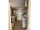 Functional laundry room featuring shelving, storage containers, and a washer and dryer at 1417 S Grand Dr, Apache Junction, AZ 85120
