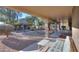 Spacious backyard with gravel landscaping and a covered patio at 143 S Los Cielos Ln, Casa Grande, AZ 85194