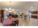 Bright dining area with chandelier and view into living room and kitchen at 143 S Los Cielos Ln, Casa Grande, AZ 85194