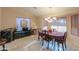 Bright dining room with an oval table and window seating at 143 S Los Cielos Ln, Casa Grande, AZ 85194