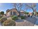 House exterior showcasing desert landscaping and a spacious yard at 143 S Los Cielos Ln, Casa Grande, AZ 85194