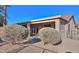 Back exterior view showing access to the patio and side yard at 143 S Los Cielos Ln, Casa Grande, AZ 85194