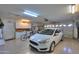 Garage with car, bicycle, and ample storage shelving at 143 S Los Cielos Ln, Casa Grande, AZ 85194