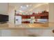 Kitchen with breakfast bar, ample counter space, and cabinets at 143 S Los Cielos Ln, Casa Grande, AZ 85194