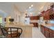 Well-equipped kitchen with ample cabinetry and a breakfast bar at 143 S Los Cielos Ln, Casa Grande, AZ 85194