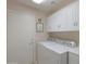 Laundry room with washer, dryer, and ample cabinet storage at 143 S Los Cielos Ln, Casa Grande, AZ 85194