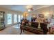 Bright living room featuring a fireplace and access to the backyard at 143 S Los Cielos Ln, Casa Grande, AZ 85194