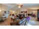 Spacious living room with comfortable furniture and views into kitchen and dining areas at 143 S Los Cielos Ln, Casa Grande, AZ 85194