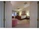 Main bedroom with large bed, sitting area, and ample natural light at 143 S Los Cielos Ln, Casa Grande, AZ 85194