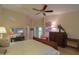 Main bedroom with king-size bed and private access to bathroom at 143 S Los Cielos Ln, Casa Grande, AZ 85194