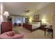 Main bedroom with king-size bed and window seating area at 143 S Los Cielos Ln, Casa Grande, AZ 85194