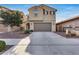 Two-story house with attached garage and landscaping at 14369 W Valentine St, Surprise, AZ 85379