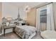 Charming bedroom with Parisian-themed wall art, comfortable bed, and stylish accents at 1447 S 239Th Dr, Buckeye, AZ 85326