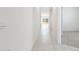 Bright hallway with tile floors and access to other rooms at 1447 S 239Th Dr, Buckeye, AZ 85326