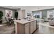 Modern kitchen with island, stainless steel appliances, and ample cabinet space at 1447 S 239Th Dr, Buckeye, AZ 85326