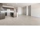 Modern kitchen with island, dark wood cabinets and tile floor at 1447 S 239Th Dr, Buckeye, AZ 85326