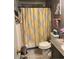 Clean bathroom with yellow and gray shower curtain and granite countertop at 14615 N 25Th Pl, Phoenix, AZ 85032