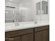 Double vanity bathroom with a large mirror at 1559 S 239Th Dr, Buckeye, AZ 85326