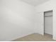Simple bedroom with closet and neutral wall color at 1559 S 239Th Dr, Buckeye, AZ 85326