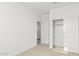 Spacious bedroom with closet and access to bathroom at 1559 S 239Th Dr, Buckeye, AZ 85326